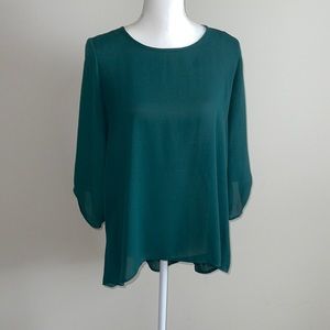 Sheer green shirt with fun back- staple piece for your closet